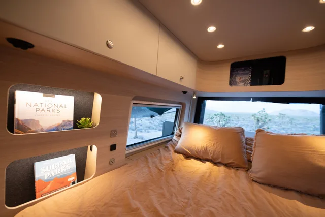 Noovo Next bedroom reading nook with lit storage shelves beside the window