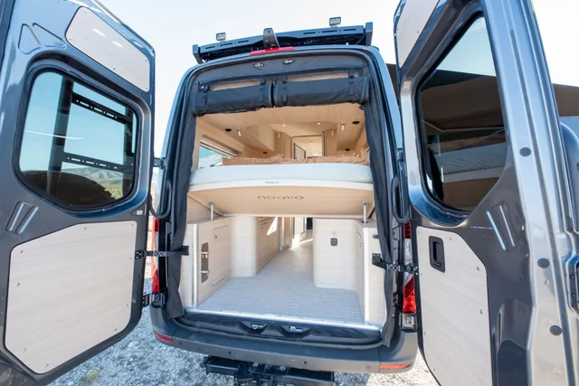 Noovo Next rear gear garage with both doors open and the lift bed raised