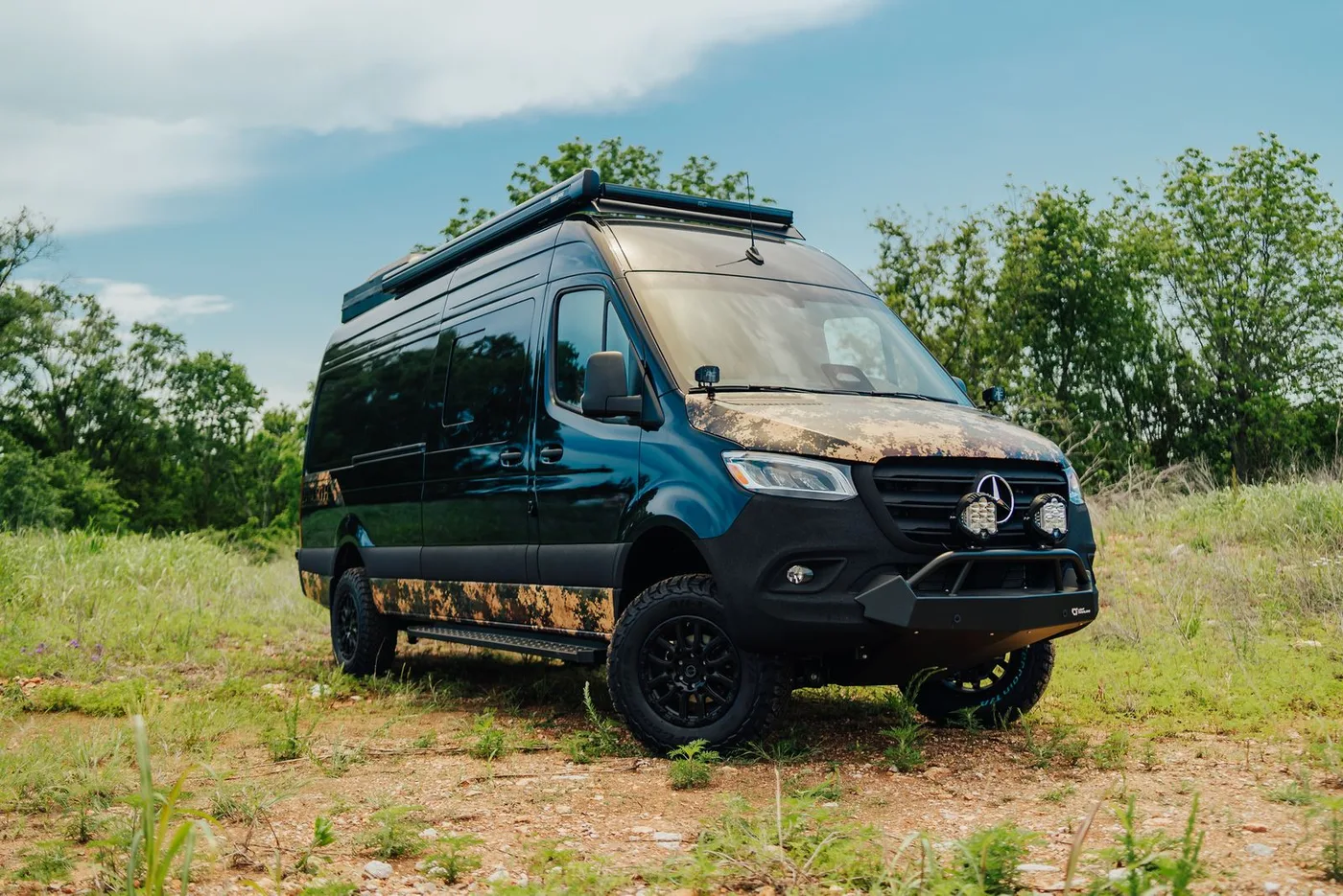 27North VX camper van parked at a remote outdoor campsite