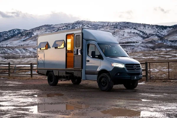 GeoTrek Verus Class B plus camper van parked on a scenic road