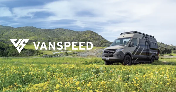 Vanspeed CA Coast camper van parked at a scenic outdoor campsite