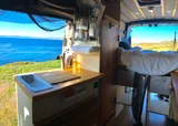 Kitchen area in Ford Transit Class B camper van rental in GLENDALE California