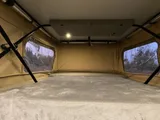 Bed setup inside Springer With Pop camper van rental in Bellevue Washington