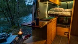 Bed setup inside Mercedes-Benz Wild Blu camper van rental in Bellevue Washington