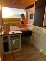 Bed setup inside Dodge Ellsworth camper van rental in Hatboro Pennsylvania
