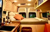 Bed setup inside Mercedes-Benz Raquel camper van rental in Asheville North Carolina