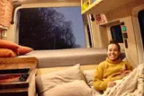 Bed setup inside Mercedes-Benz Raquel camper van rental in Asheville North Carolina