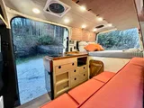 Bed setup inside Mercedes-Benz Raquel camper van rental in Asheville North Carolina