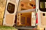 Bed setup inside Mercedes-Benz Raquel camper van rental in Asheville North Carolina