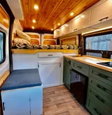 Kitchen area in Dodge Alpenglow Class B camper van rental in Bellevue Washington