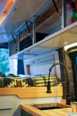Kitchen area in Dodge Alpenglow Class B camper van rental in Bellevue Washington