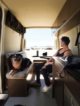 Bed setup inside Mercedes-Benz Astro Camper camper van rental in Eastvale California