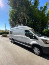 Driver cockpit of Ford Transit camper van rental in Lakewood California
