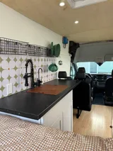 Kitchen area in Ford Transit Class B camper van rental in Lakewood California