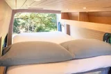 Bed setup inside Forged Vans Sprinter camper van rental in Bellevue Washington