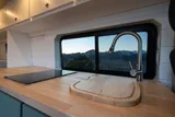 Kitchen area in Wanderful Wheels HoneyVroom Class B camper van rental in Bellevue Washington