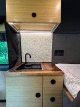 Kitchen area in VT Adventures joy Ride Class B camper van rental in Burlington Vermont