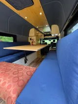 Dining area in VT Adventures joy Ride camper van rental in Burlington Vermont