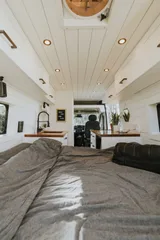 Bed setup inside Noma Vans Promaster 2500 camper van rental in Bellevue Washington