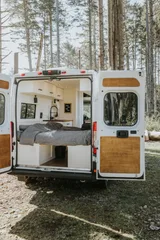 Bed setup inside Noma Vans Promaster 2500 camper van rental in Bellevue Washington