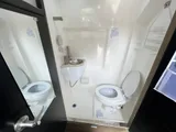 Bathroom in Midwest Automotive Designs Passage camper van rental in GLENDALE California