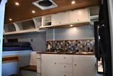Kitchen area in RAM River Run Class B camper van rental in Spokane Washington