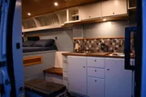 Kitchen area in RAM River Run Class B camper van rental in Spokane Washington