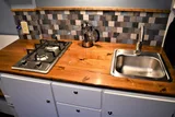 Kitchen area in RAM River Run Class B camper van rental in Spokane Washington