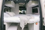 Bed setup inside TrueVan Vision X camper van rental in Eastvale California