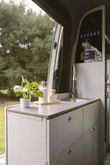 Kitchen area in TrueVan Vision X Class B camper van rental in Eastvale California