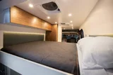 Bed setup inside Wheel Suite Promaster 3500 camper van rental in Hackensack New Jersey