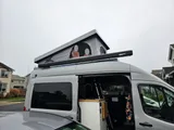 Bed setup inside Grit Overland GO A/T camper van rental in Issaquah Washington