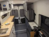Bed setup inside Grit Overland GO A/T camper van rental in Issaquah Washington