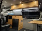 Kitchen area in Navan Vans Guinevere Class B camper van rental in Bellevue Washington