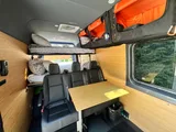 Bed setup inside Weekend Vans Sprinter 170 4X4 camper van rental in Spokane Washington