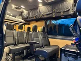 Bed setup inside Weekend Vans Sprinter 170 4X4 camper van rental in Spokane Washington