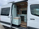 Kitchen area in Scenic Vans Aspen Class B camper van rental in Roseville California