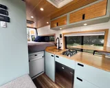 Kitchen area in Scenic Vans Aspen Class B camper van rental in Roseville California