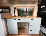 Kitchen area in Scenic Vans Aspen Class B camper van rental in Roseville California
