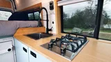 Kitchen area in Scenic Vans Aspen Class B camper van rental in Roseville California