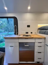 Kitchen area in Wheel Suites Grand Suite Class B camper van rental in Hackensack New Jersey