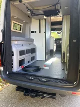 Bed setup inside Revel Revel camper van rental in Bellevue Washington