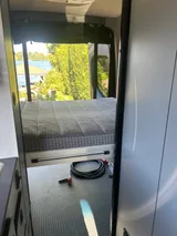 Bed setup inside Revel Revel camper van rental in Bellevue Washington