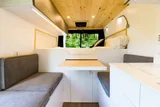 Bed setup inside Vanture Customs Trailhead camper van rental in Hatboro Pennsylvania