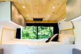Bed setup inside Vanture Customs Trailhead camper van rental in Hatboro Pennsylvania