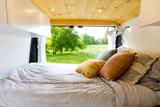 Bed setup inside Vanture Customs Wanderer camper van rental in Hatboro Pennsylvania