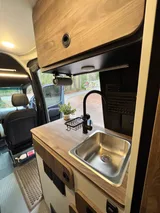 Kitchen area in Tiffin GH1 Class B camper van rental in Bellevue Washington