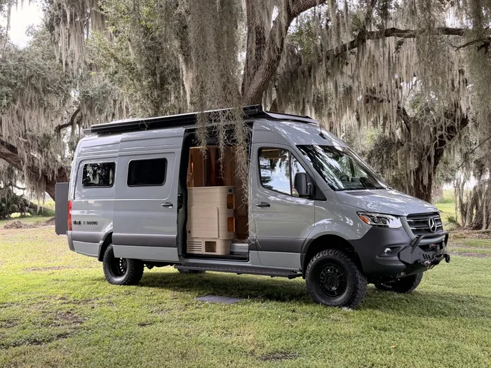 2026 Noovo Next AWD camper van exterior with sliding door open, Orlando camper van rental